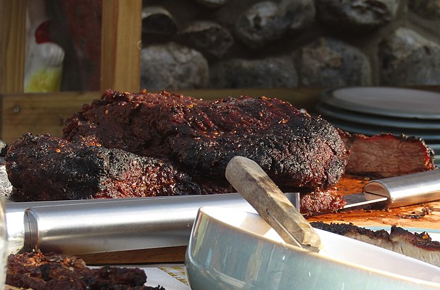 500 gallon offset bbq smoker in a golder field